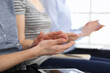 © Iryna - Business people clapping at meeting or conference, close-up of hands. Group of unknown businessmen and women in modern white office. Success teamwork, corporate coaching and applause concept