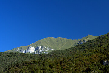 mountain landscape with blue sky,nature, blue, peak,rock, travel, trees, green,panorama, high,view, 