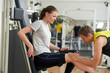 © DenisProduction.com - Young unhappy woman with leg injury at gym. Stressed girl suffering from severe knee pain after workout. Sport trauma concept.