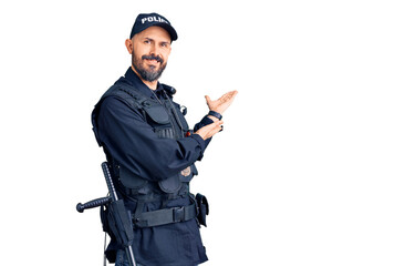 Sticker - Young handsome man wearing police uniform inviting to enter smiling natural with open hand