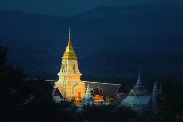 Chaiyaphum Temple set amid green mountains with sunset sky,Place for religious practices of Thailand