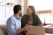 © fizkes - Excited young Caucasian couple buyers feel overjoyed unpacking cardboard parcel box with internet order. Happy man and woman clients laugh enjoy unboxing shopping online. Shipping, delivery concept.