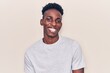 © Krakenimages.com - Young african american man wearing casual clothes winking looking at the camera with sexy expression, cheerful and happy face.