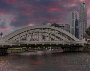 Wall Mural - A view from a boat on the Singapore river just after sunset towards the Elgin Bridge in Singapore, Asia