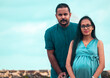 © nilanka - The pregnant young lady and her handsome husband portrait, under the blue skies natural lighting conditions in Galle fort, South Asian young couple.