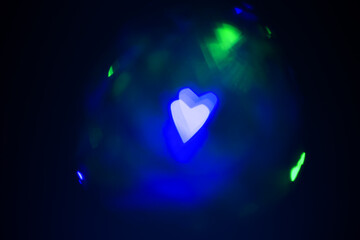 Wall Mural - Abstract bokeh hearts background wallpaper. lights in the night city