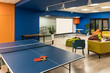Ping pong tennis at modern creative office space