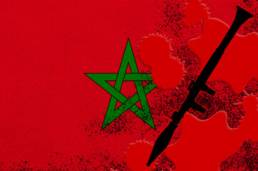 Morocco flag and black RPG-7 rocket-propelled grenade launcher in red blood. Concept for terror attack or military operations with lethal outcome