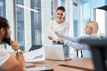 Wall Mural - Business people analyzing data using computer