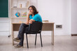 © Elnur - Young male student in front of green board