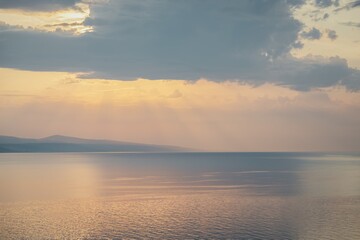 Wall Mural - Beautiful sunset in Croatia. Sunbeams and clouds