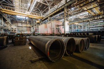 Wall Mural - New cast iron pipes for pipeline construction in warehouse