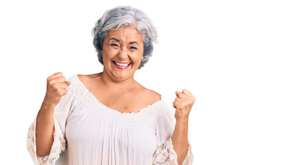 Poster - Senior woman with gray hair wearing bohemian style very happy and excited doing winner gesture with arms raised, smiling and screaming for success. celebration concept.