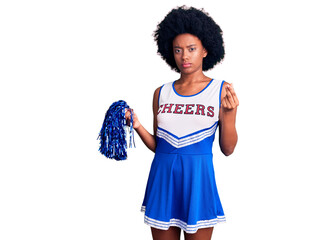 Poster - Young african american woman wearing cheerleader uniform holding pompom doing money gesture with hands, asking for salary payment, millionaire business