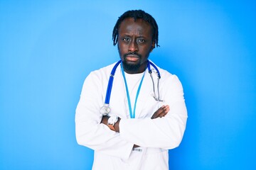 Poster - Young african american man with braids wearing doctor stethoscope and id pass skeptic and nervous, disapproving expression on face with crossed arms. negative person.