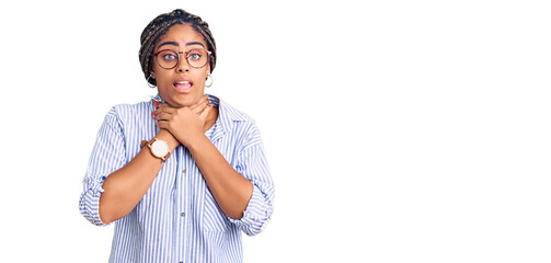 Young african american woman with braids wearing casual clothes and glasses shouting and suffocate because painful strangle. health problem. asphyxiate and suicide concept.