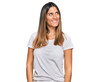 © Krakenimages.com - Young woman wearing casual white t shirt looking away to side with smile on face, natural expression. laughing confident.