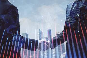 Double exposure of forex graph hologram and handshake of two men. Stock market concept.