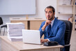 © Elnur - Young male employee and too much work in the office