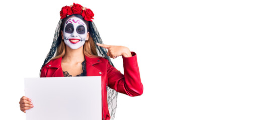 Sticker - Woman wearing day of the dead costume holding blank empty banner pointing finger to one self smiling happy and proud