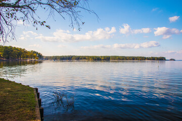 A beautiful calm lake scene in the country in Georgia clouds and blue sky