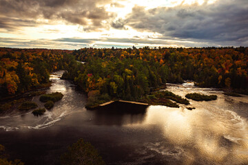Wall Mural - beautiful aerial of the lower waterfall cascades and island in the tahquamenon river surrounded by e