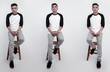 © DendraCreative - Handsome man wearing black white raglan t-shirt was sitting in a chair with plain background.