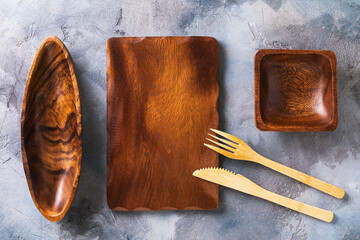 Wall Mural - Empty wooden cutlery on the table, top view. Food background