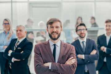 Wall Mural - happy young entrepreneur standing in the office