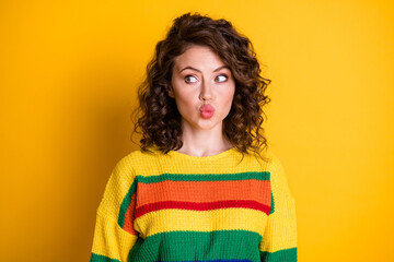 Canvas Print - Photo of lovely young girl lips blow air kiss look side empty space wear striped pullover isolated yellow color background