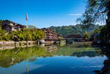 Fototapeta Krajobraz - the river, the boat, stone bridge and the old houses at ancient phoenix town in the morning at Hunan, China.