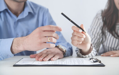 Wall Mural - Couple with divorce contract and ring. Divorce