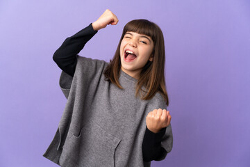 Little girl over isolated background celebrating a victory