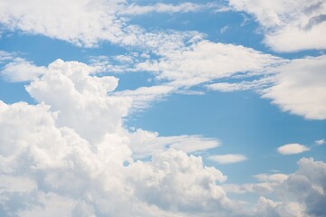 Wall Mural - White fluffy clouds in blue sky, beautiful sky background