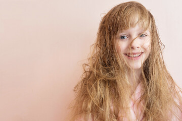 Wall Mural - a blonde girl with very matted hair laughs