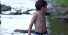 Toddler Boy Looks Around At Rivers Edge Nervously For Parents - Close Up On Face