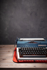 Sticker - old retro typewriter at wooden table