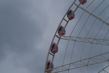 Part Of Ferris Wheel And Cloudy Sky