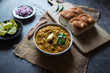 © Debashis - Close up popular Indian fast food pav bhaji and condiments on a background.