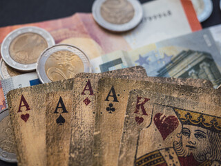 Poker cards and money. Euros coins. Gamble concept