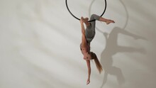 A Girl Of Athletic Build On An Acrobatic Ring.