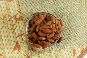 Wall Mural - salty roasted almond dry fruit nuts in bowl