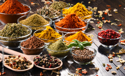 Papel de parede Variety of spices and herbs on kitchen table