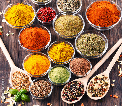 Tela Variety of spices and herbs on kitchen table
