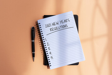 Wall Mural - New Year Resolution 2021 on notepad with pen and shadow