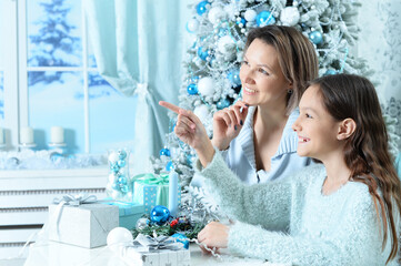 Sticker - Girl with her mother preparing for Christmas