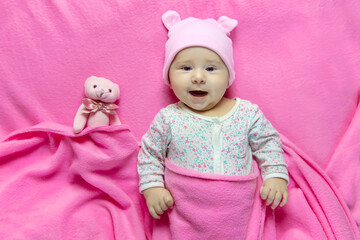 Poster - Baby sleeps with a bear. Selective focus.