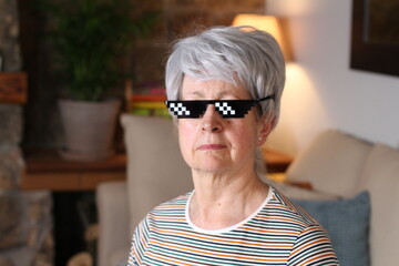 Senior woman wearing epic pixilated sunglasses
