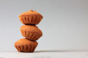 a pile of teacakes isolated on grey background. Minimal concept