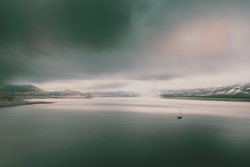 Wall Mural - The Gunnison river on a cold autumn day with dramatic snow clouds rolling in